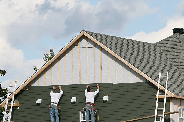 Professional Vinyl Siding technician working in East Setauket, NY